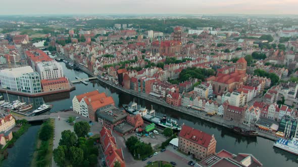 Establishing Aerial View of Gdansk Skyline with Old Town Roofs and River
