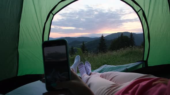 Rest of Tourists in a Tent in the Mountains of the Swiss Alps