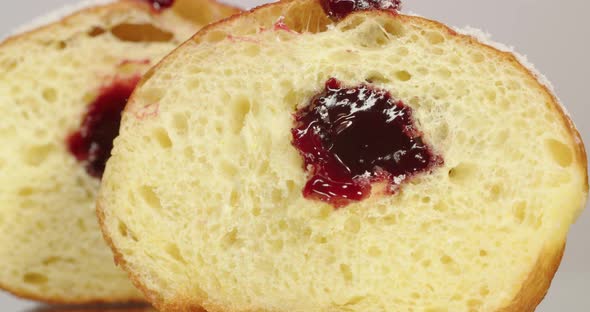 Donut With Jam Sprinkled With Powdered Sugar