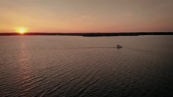 View from drone flying over Mindemoya Lake in Manitoulin Island, Canada at golden hour