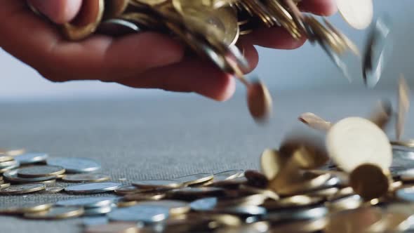 Businessman Holding Coins in his Palms