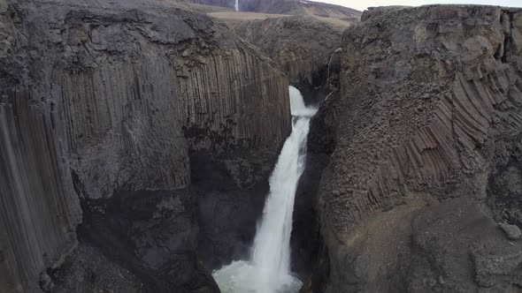 reversing reveal of Litlanesfoss waterfall and the basaltic Fljótsdalur Valley