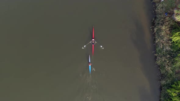 Two seat Sport Kayaks rowing on tranquil river water, Aerial view.