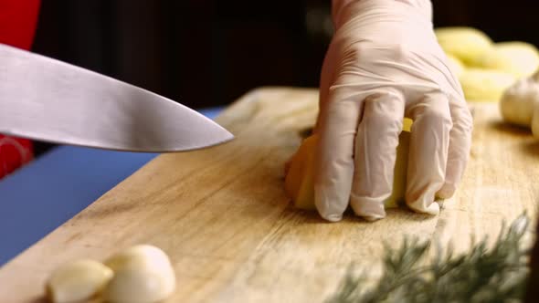 Woman Chef Throws Sliced Potatoes in a Pot to Boil the Domestic Kitchen