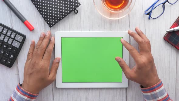 Top View of Man's Hand Working on Digital Tablet 