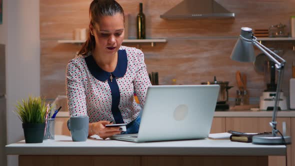 Hispanic Woman Shopping Online Using Credit Card