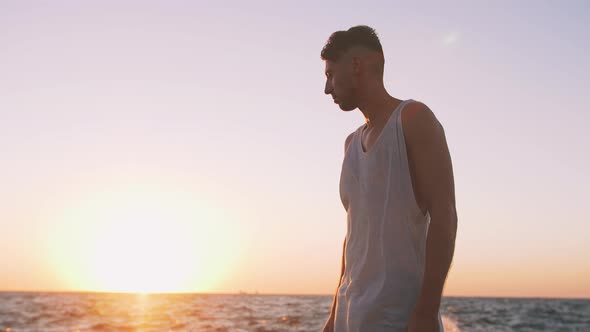 Young Man on Pier Toward Rough Ocean Slow Motion