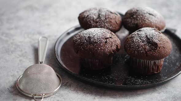 Fresh and Tasty Chocolate Muffins Served on Plate