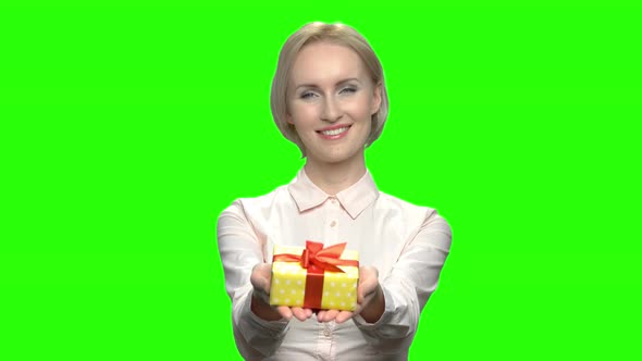 Portrait of Caucasian Woman Giving Gift Box