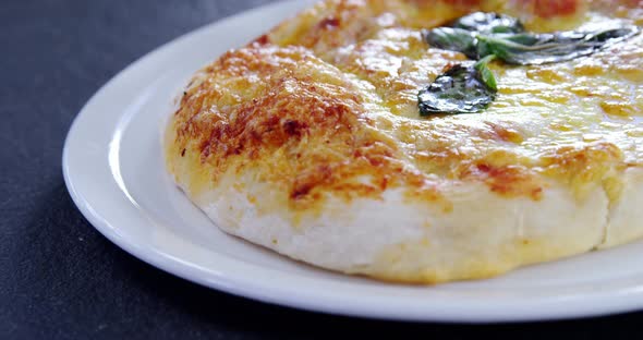 Baked pizza served on plate