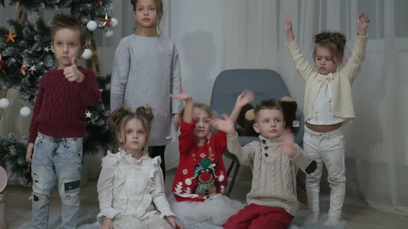 A group of children with New Year's gifts, happy friends for Christmas