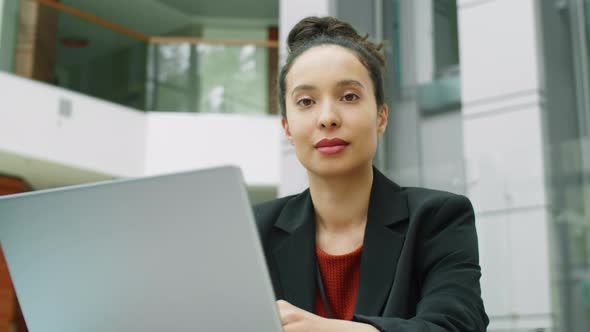 Portrait of Businesswoman with Laptop in Office Center