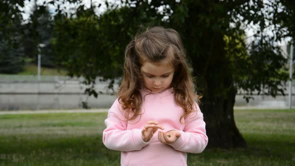 Little Girl Counts Coins