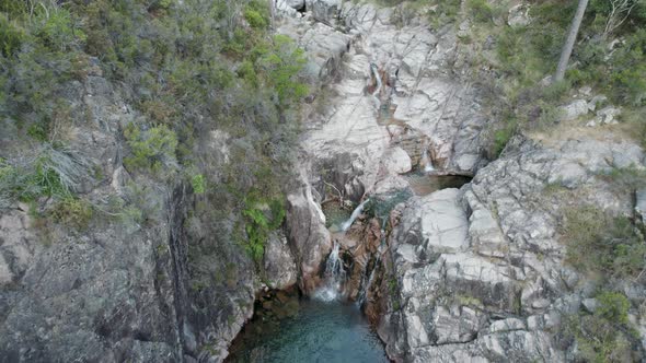 Aerial top-down forward over waterfalls of Portela Do Homem in Portugal