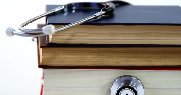 Stethoscope with stack of books