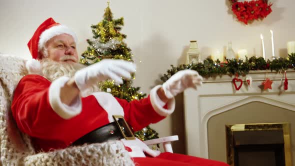 Santa claus relaxing with hands behind head
