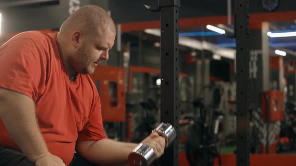 Overweight Man Is Heavy Workout at Gym for Healthy Beautiful and Athletic Body.