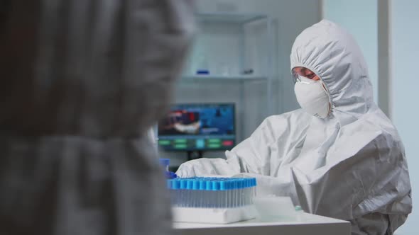 Woman Scientist Working at Vaccine Development Typing on Pc alt