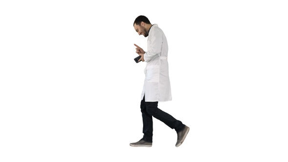 Walking attractive laughing doctor on white background.