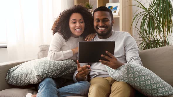 Couple Having Video Call on Tablet Pc at Home