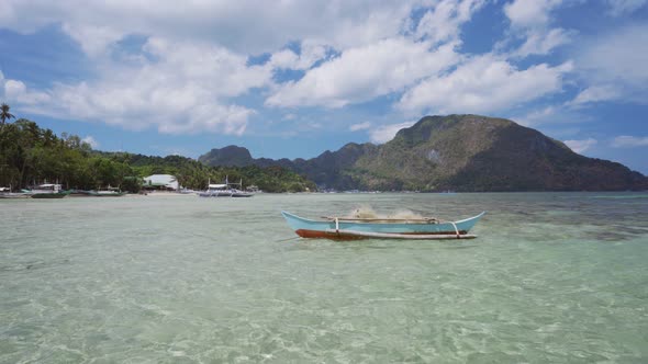 El Nido Bay. Palawan Island, Philippines. Filippino Fishing Boat Float in Shallow Water Lagoon