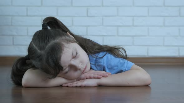 Child relax on the floor. 