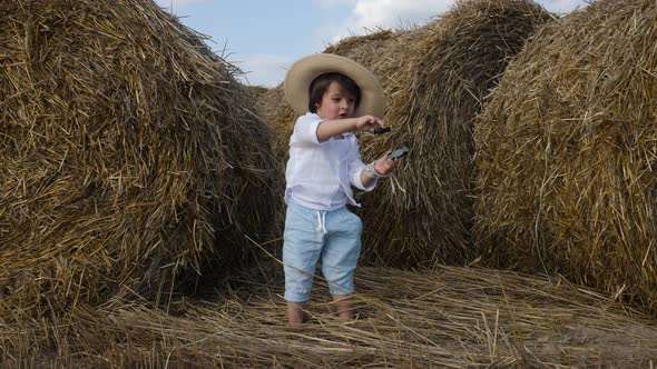 Boy in White Shirt and T-shirt in Blue Pants Dancing in the Field