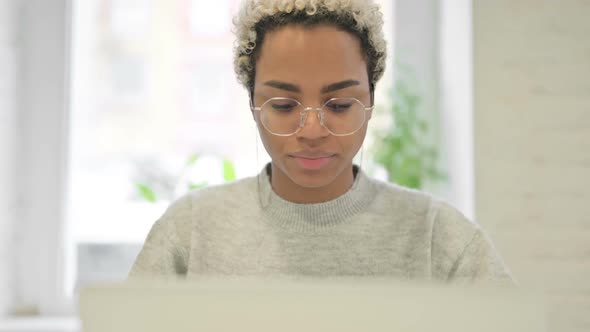 Close Up of African Woman Working on Laptop