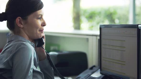 Officer worker receiving and transferring telephone call