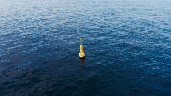 Yellow Marine Buoy in the Ocean