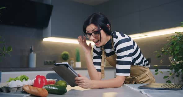 Woman Showing Emotional Reaction on Good News on Tablet Screen