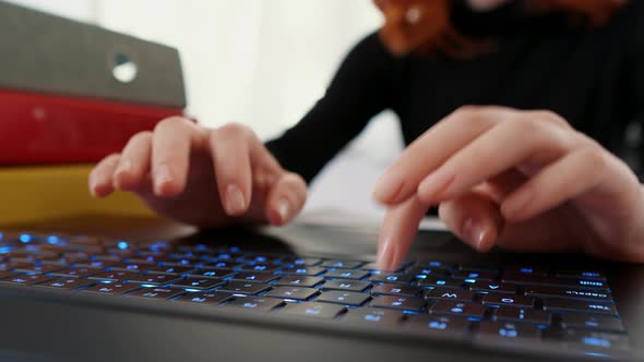 Typing on laptop keyboard, work office day