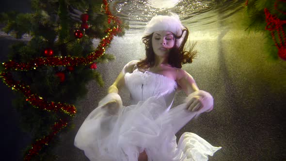 Seductive Woman in Snow Maiden Suit Underwater Slow Motion