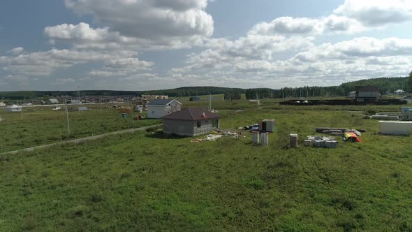 Construction houses in new cottage village. Aerial 35