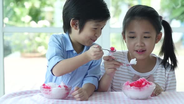 Happy Little Asian Children  Eating Shaved Ice At Home Slow Motion