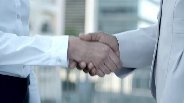 Closeup Shot of People Shaking Hands