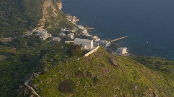 Church on Top of a Cliff Facing the Aegean Sea in the Island of Milos Aerial