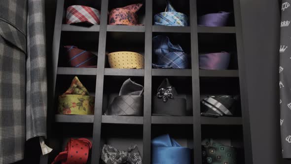 Big Selection of Classic Silk Neck Ties. Collection of Assorted Classic Ties on a Shelf in a Store