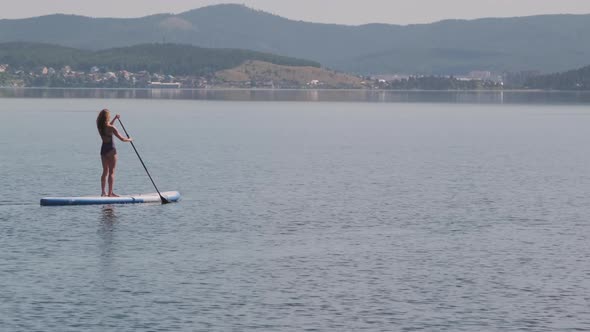 Woman Exploring Aria on Sup Board