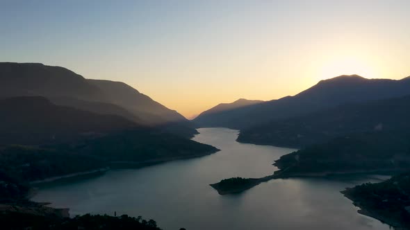 Sunset Over the River in the Mountains Filmed on a Drone