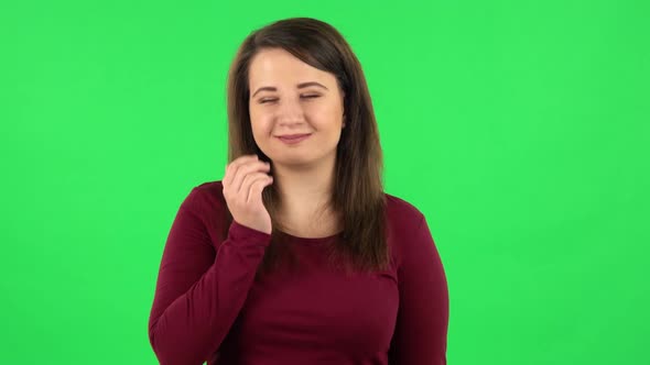 Portrait of Pretty Girl Smiling and Blowing Kiss. Green Screen