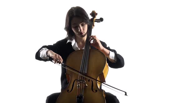 Woman Plays a Violoncello Rehearsing a Composition