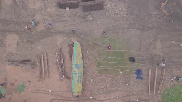 Fishermen working on fishing nets, Varkala, India. Top down aerial drone view