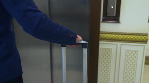 Businessman waiting for elevator. Man waiting for elevator in hotel