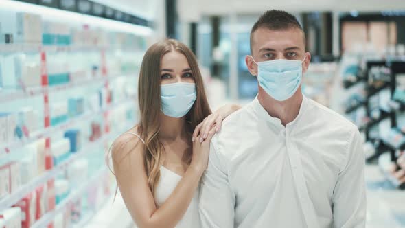 Portrait of Cute Young Girl and Caucasian Guy in Medical Masks