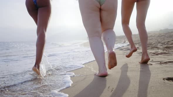 young women having fun on the beach