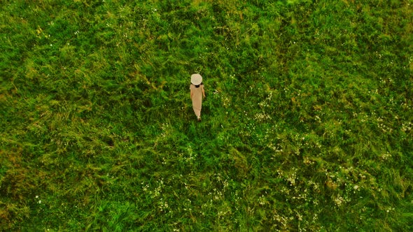 Aerial View on Female Goes Outdoors