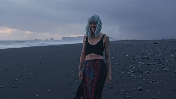 Beautiful Woman Walking On Black Beach