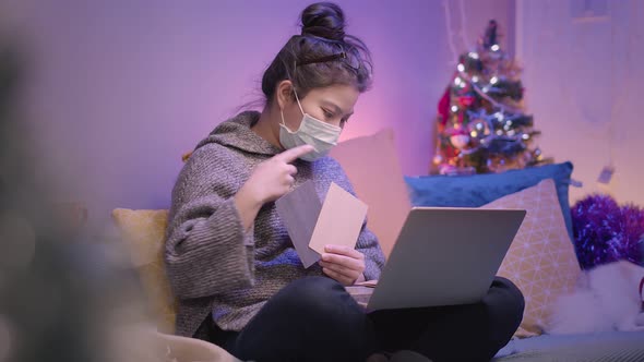 working at home asian female woman wear face mask virus protecting working with hand use laptop