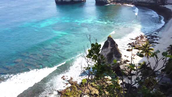 Beautiful Tropical Beach Aerial - a Bird's Eye View of Ocean Waves Crashing Against an Empty Beach